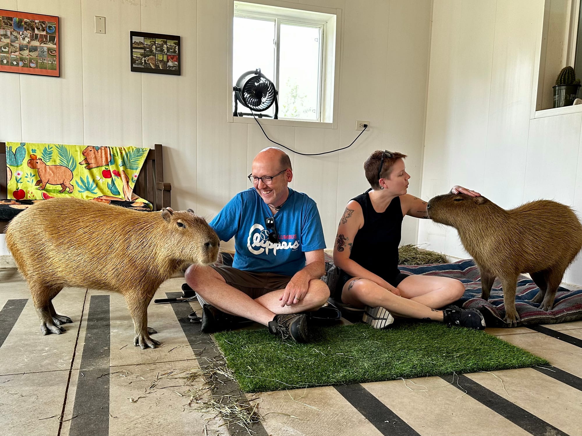 My wife Allison and me petting capybaras