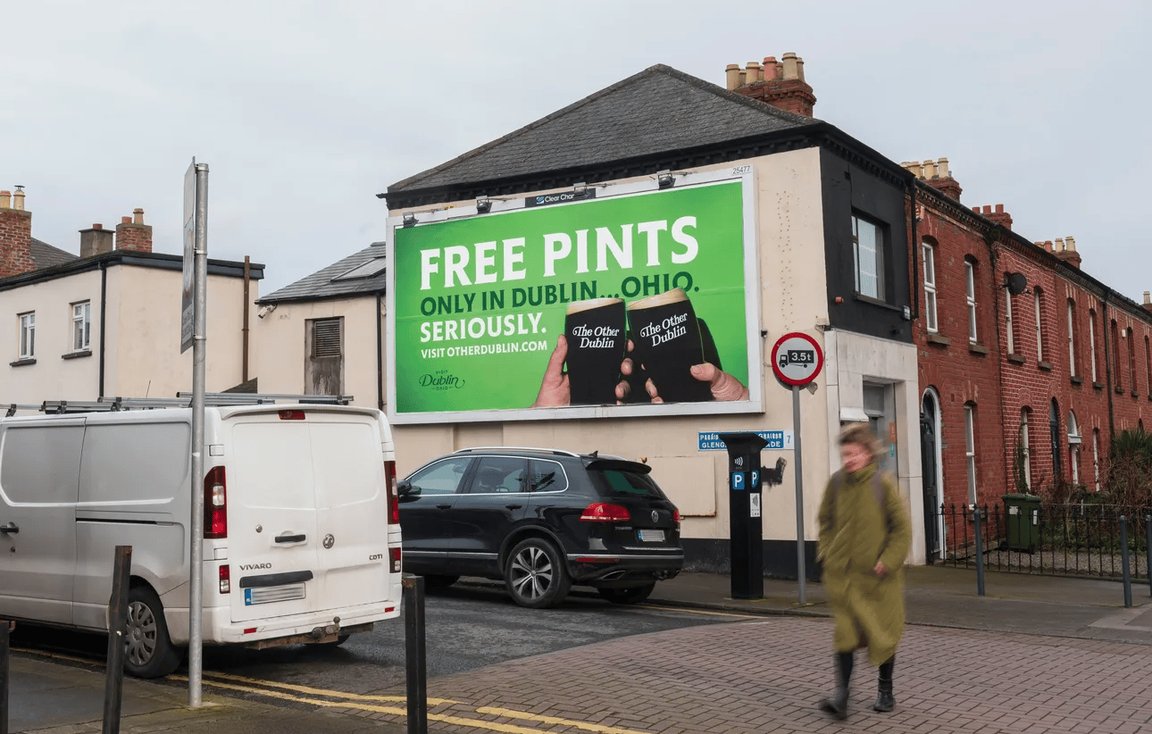 Billboard in a Dublin, Ireland city street that says &quot;FREE PINTS: only in Dublin, Ohio. Seriously.&quot;