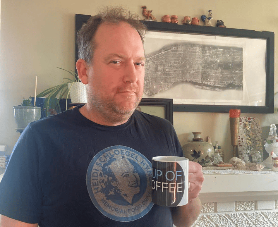 Subscriber Frank Schloegel holding a Cup of Coffee mug