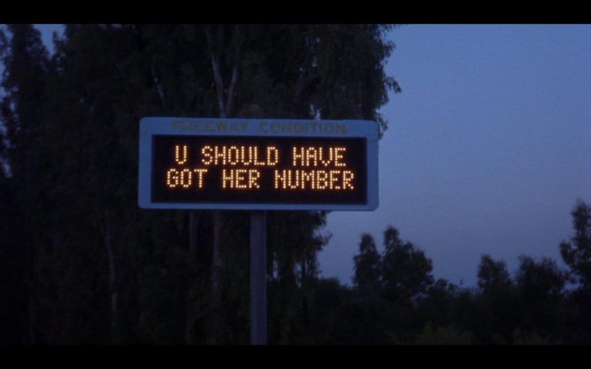 Highway sign from the movie "LA Story" that says "U should have got her number"