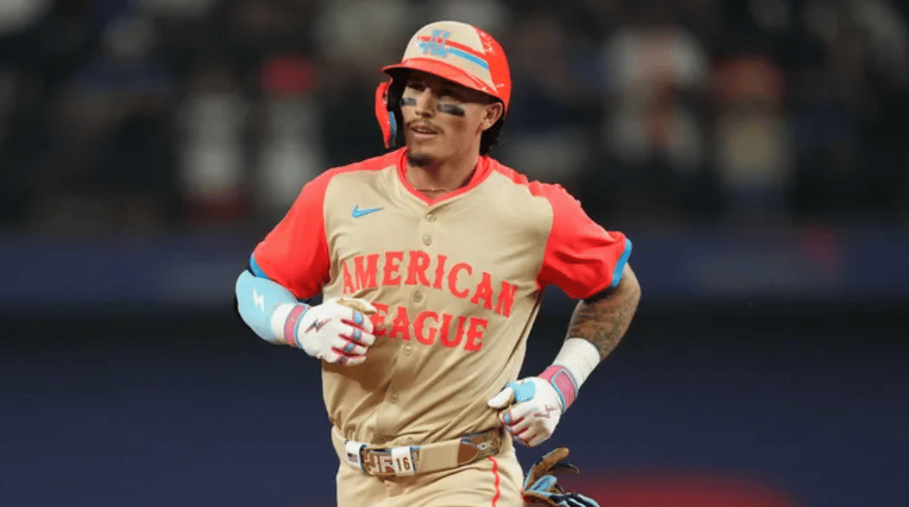 Jarren Duran wearing a khaki and bright orange uniform with "American League" written on the chest