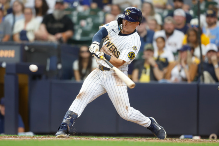 Isaac Collins hitting a home run