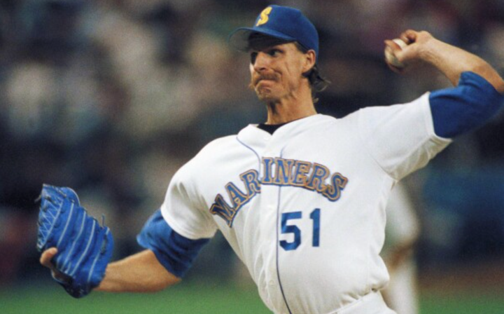 Randy Johnson pitching while wearing a Mariners uniform 