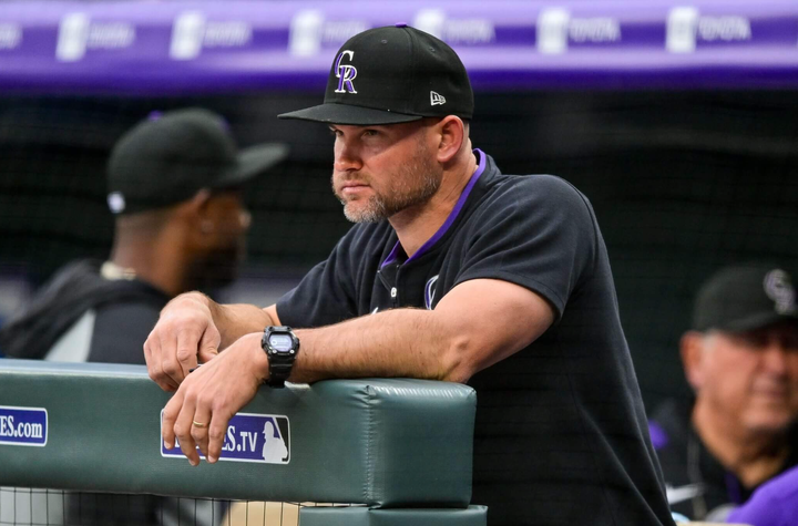Manager Warren Schaeffer of the Rockies, looking out onto the field from the dugout