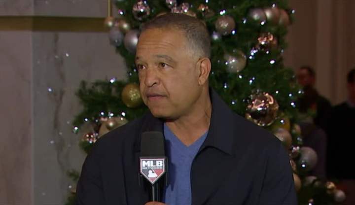 Dave Roberts in street clothes giving an interview